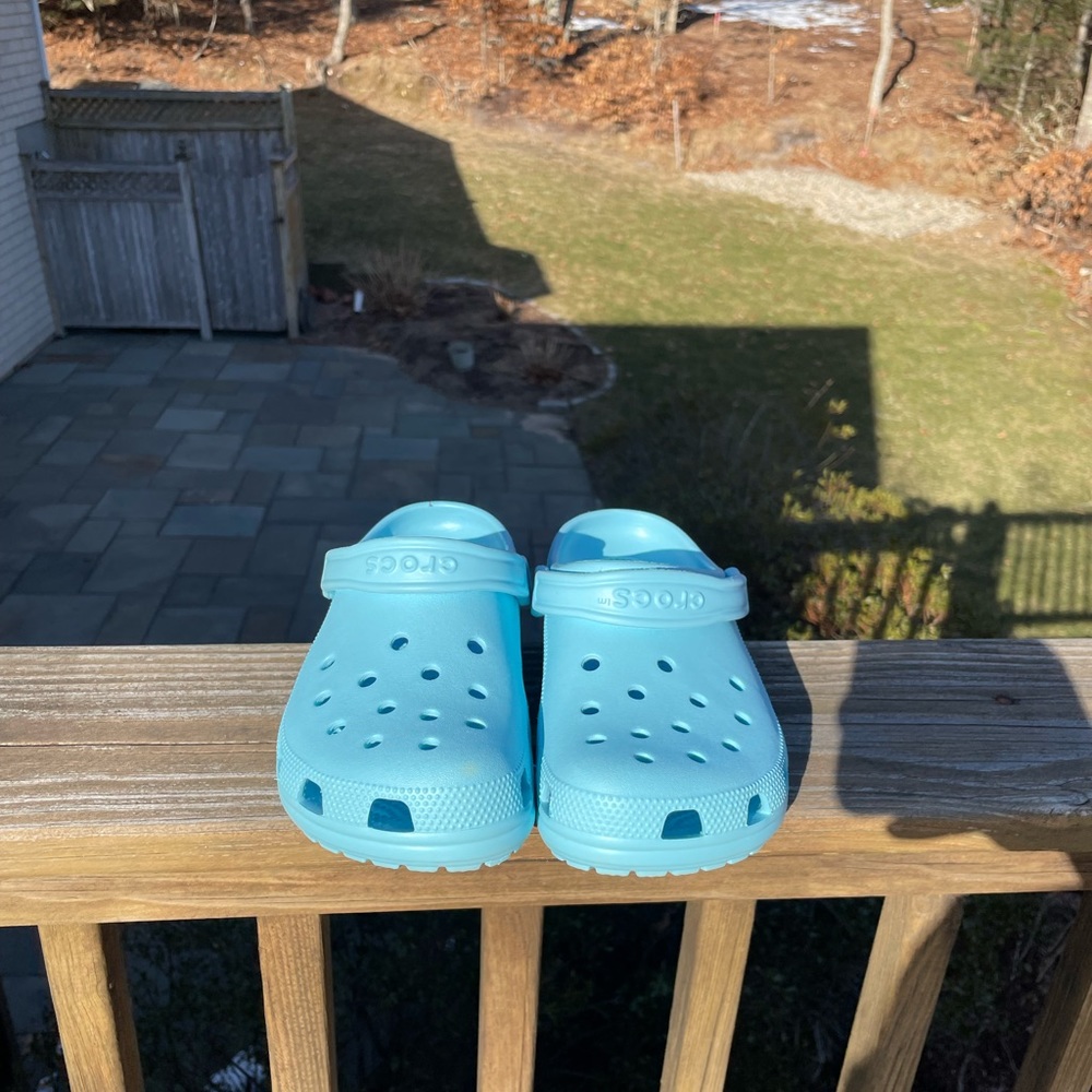 Turquoise Crocs.